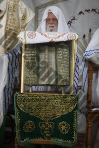 The Late High Priest, Aharon son of Ab Hisada With the scroll of Abisha.